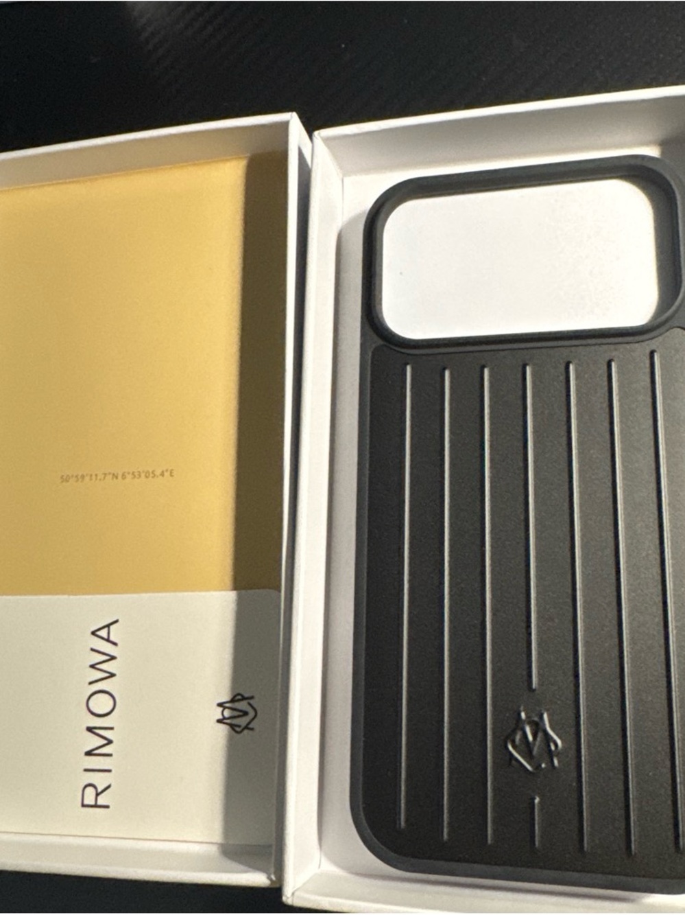 RIMOWA 17 Pro Max Black Ribbed Phone Case with Silver Camera Trim